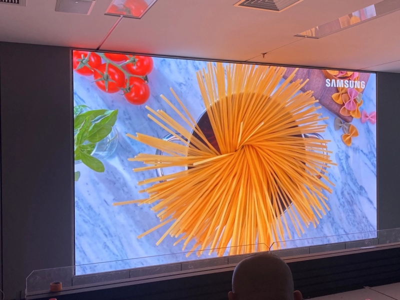 Is it better to use projection or LED screens in conference rooms?